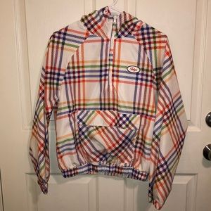 white windbreaker with colorful stripes